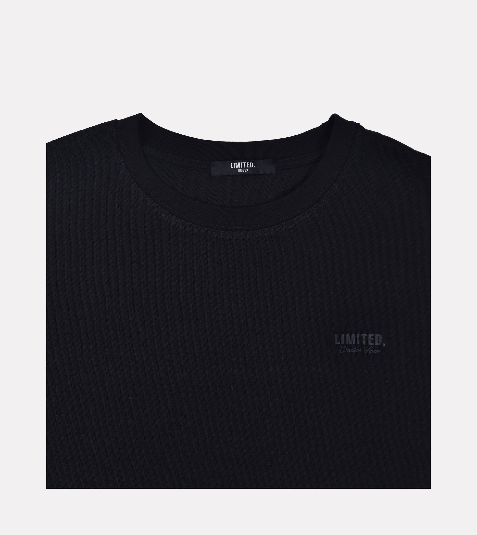 Close-up LIMITED. Oversized mens t-shirt front view in black with black small branding on the left chest.
