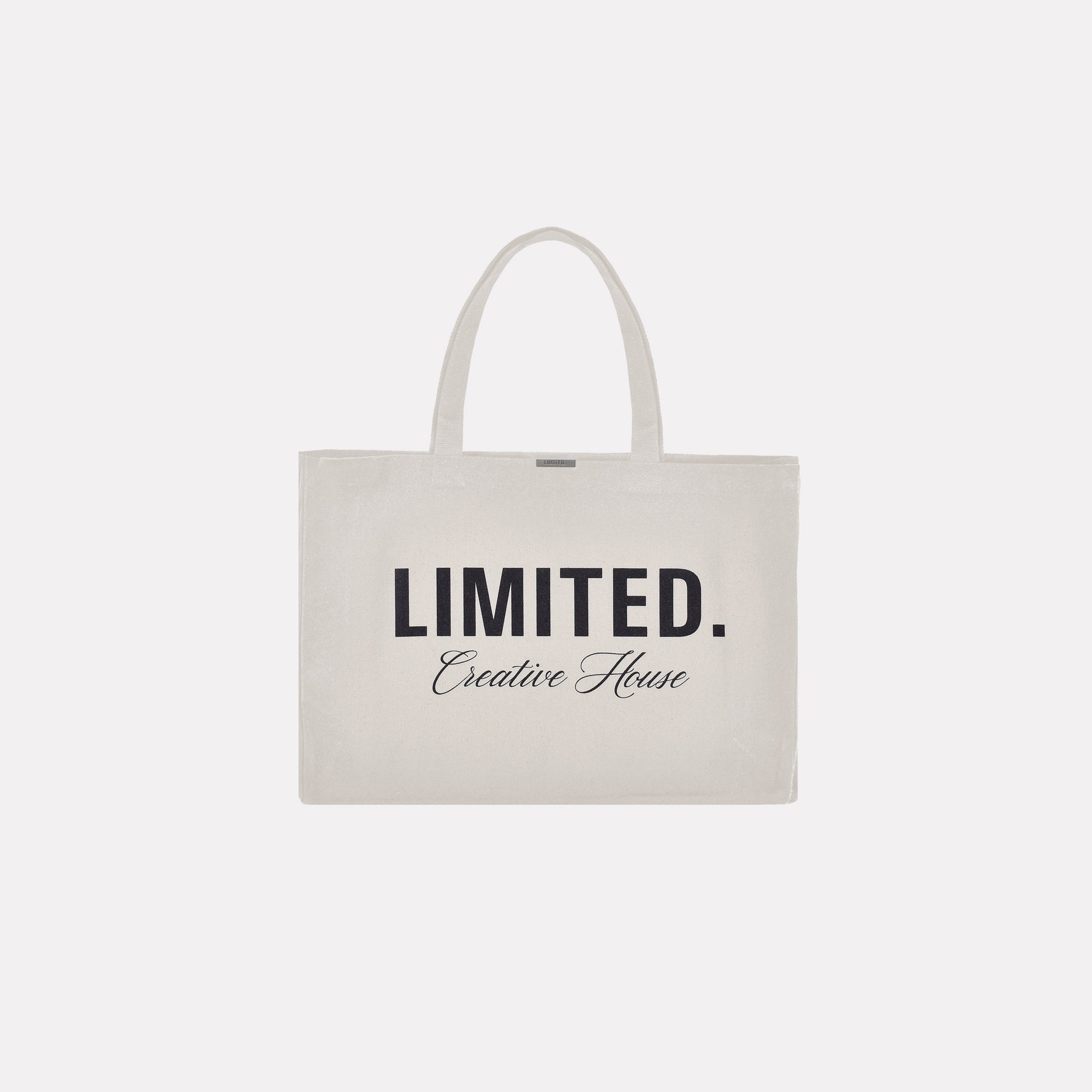 Signature LIMITED. Tote Bag in natural canvas colour. Minimalistic streetwear style tote bag with black branding.